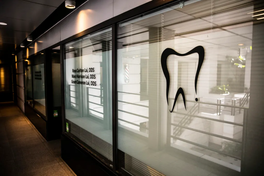 office tour window with tooth logo