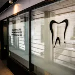 office tour window with tooth logo